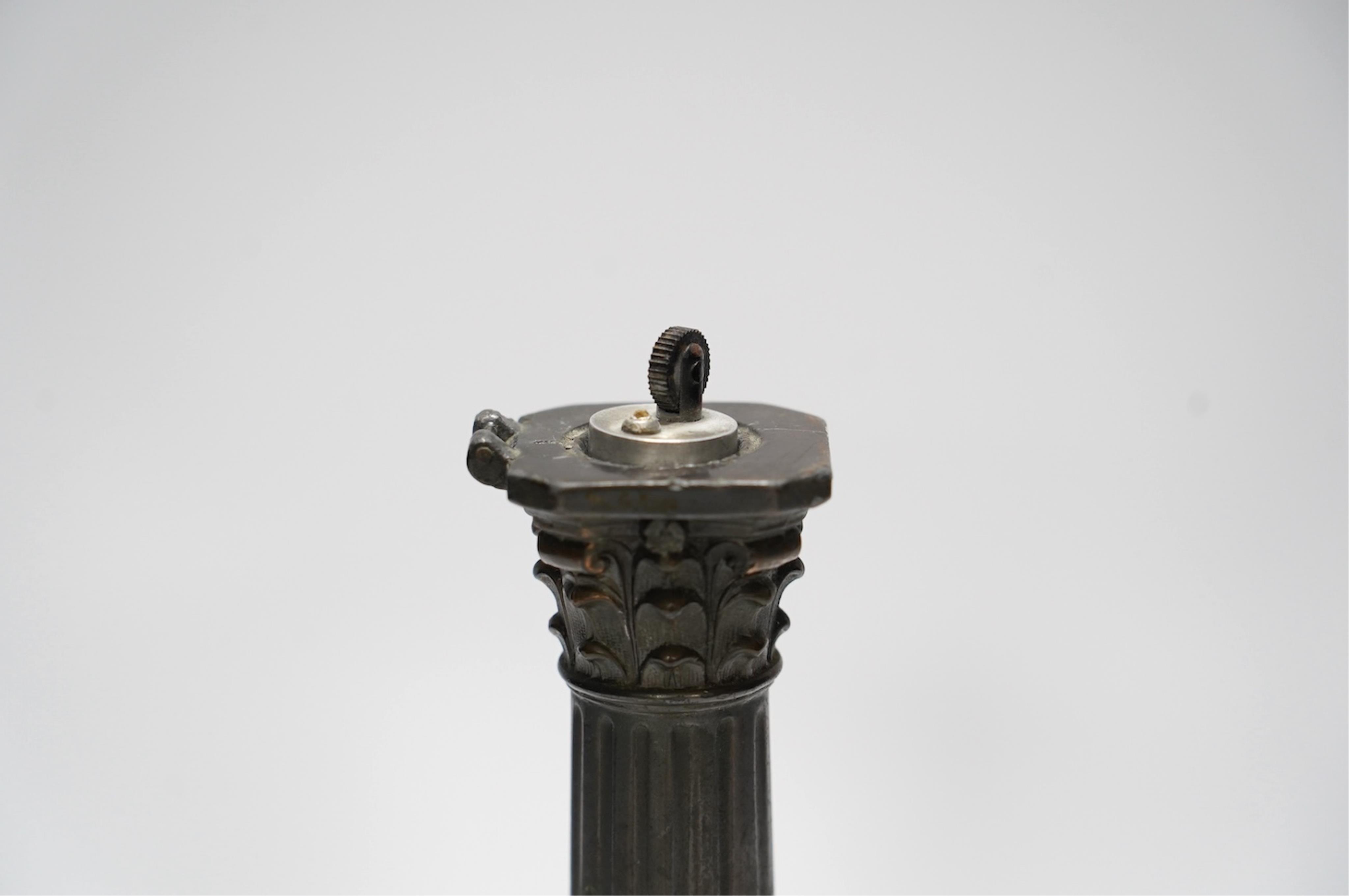 A spelter bust of Lord Nelson on a column table lighter, 25cm high. Condition - poor to fair, hinge broken, untested
